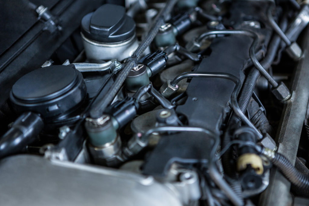 Close-up of car engine at repair garage