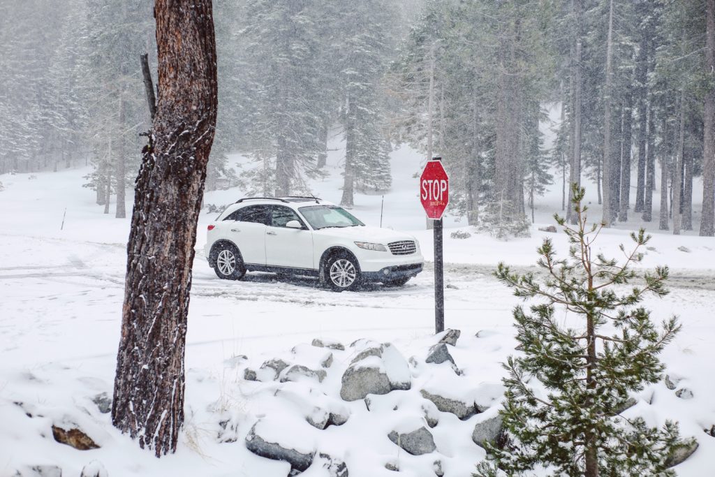 winter snow on road stop sign