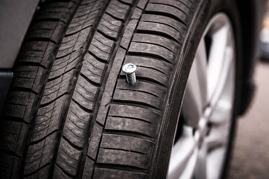 Tire with Nail Embedded in Tread
